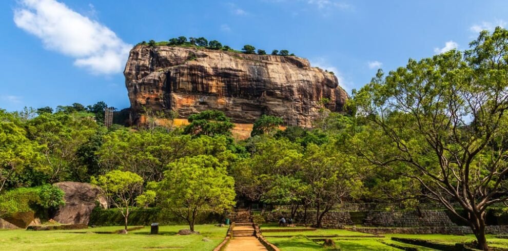 Sigiriya: Majestic rock fortress rising above lush landscapes, a UNESCO World Heritage Site beckoning with ancient history and breathtaking vistas.