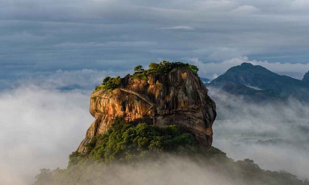 Sigiriya day tour with Sri Lanka Drivers and Guides, featuring Lion Rock, frescoes, and Dambulla Cave Temple.